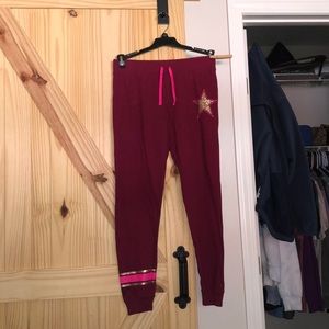 maroon girls joggers with pink and gold accents.